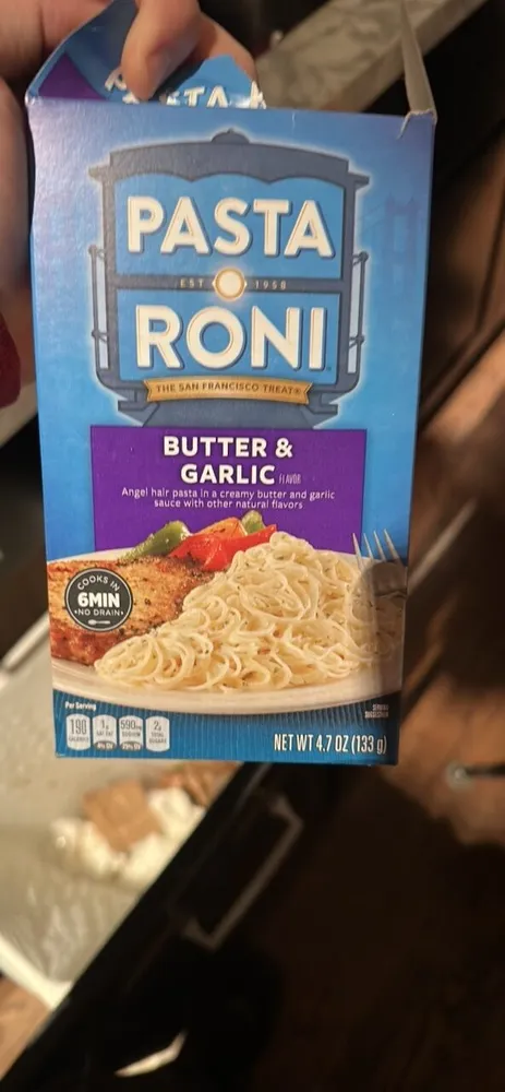 Angel hair pasta in a creamy butter and garlic sauce with other natural flavors