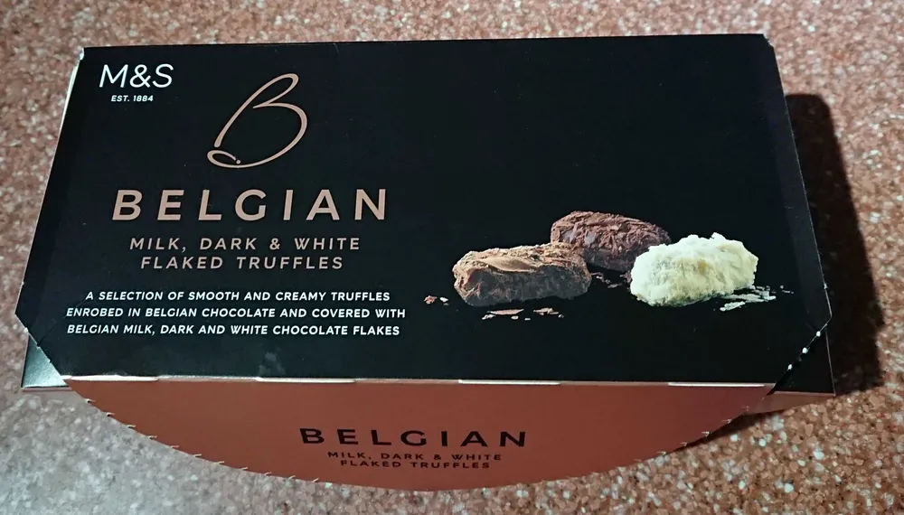 Belgian milk, dark, and white flaked truffles