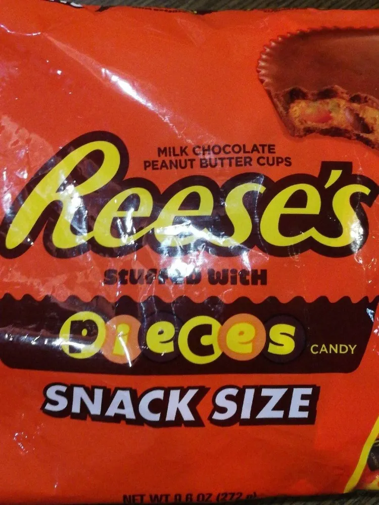 Milk chocolate peanut butter cups stuffed with pieces candy