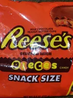 Milk chocolate peanut butter cups stuffed with pieces candy