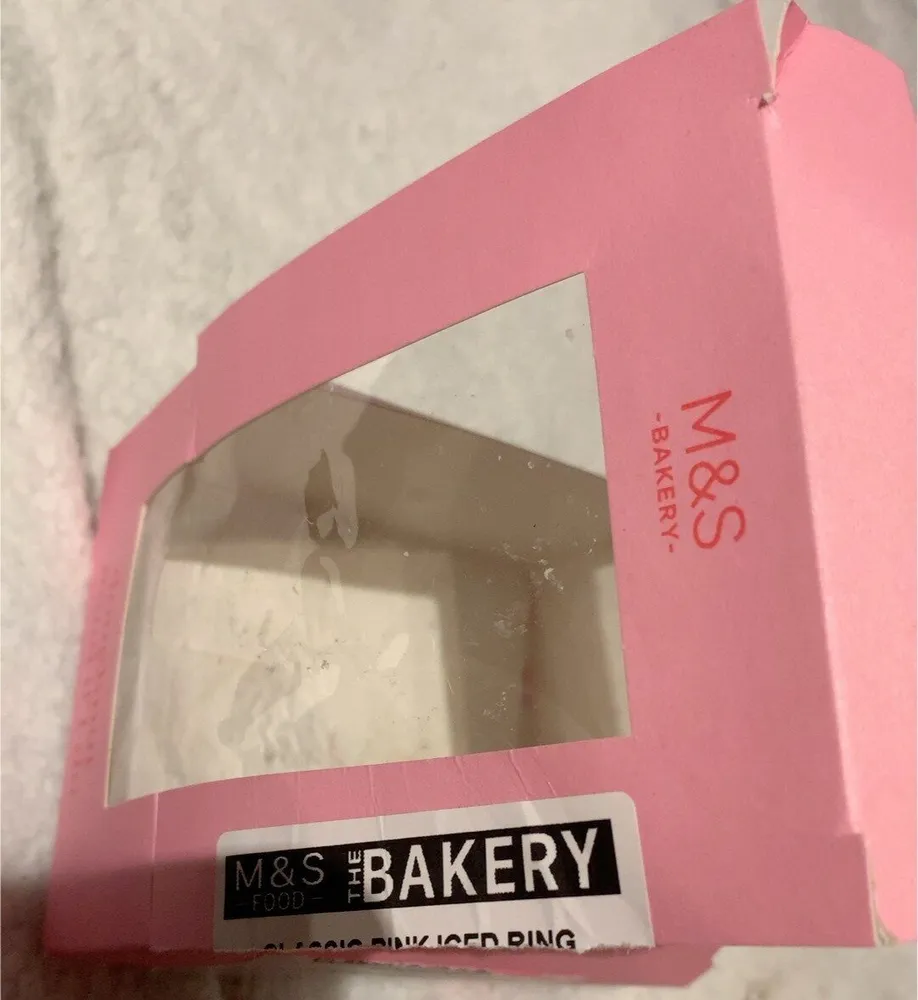 Classic pink iced ring donut