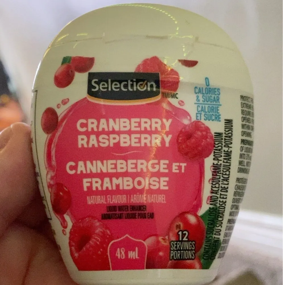 Selection cranberry raspberry liquid water enhancer