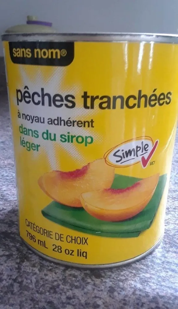 Pêche tranchée  dans un sirop léger