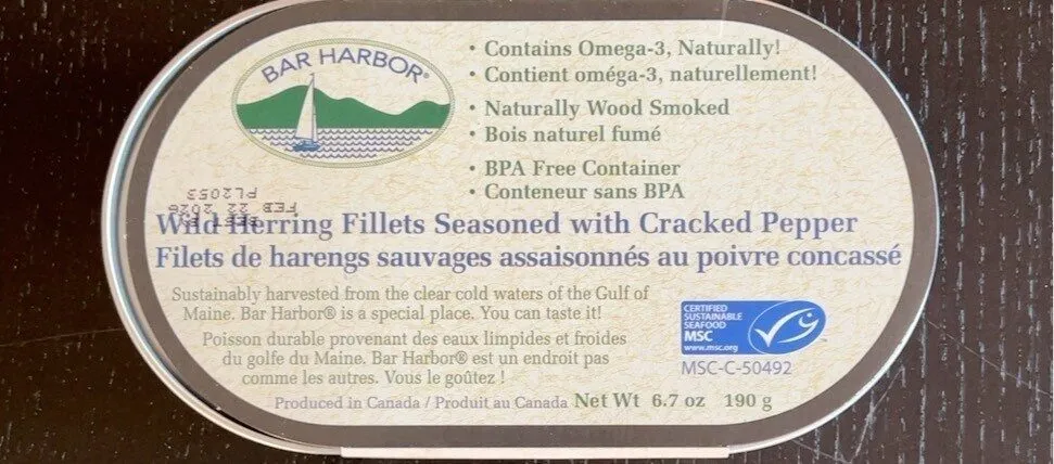 Wild herring fillets seasoned with cracked pepper