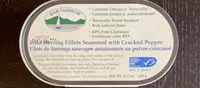 Wild herring fillets seasoned with cracked pepper