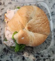 Meal simple oven roasted turkey & muenster cheese on croissant
