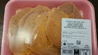 Boneless uncooked tenderized breaded pork loun