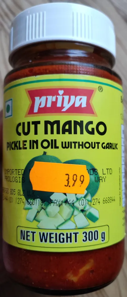 Cut mango pickle in oil without garlic