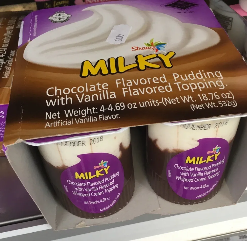 Milky chocolate flavored pudding with vanilla flavored whipped cream topping