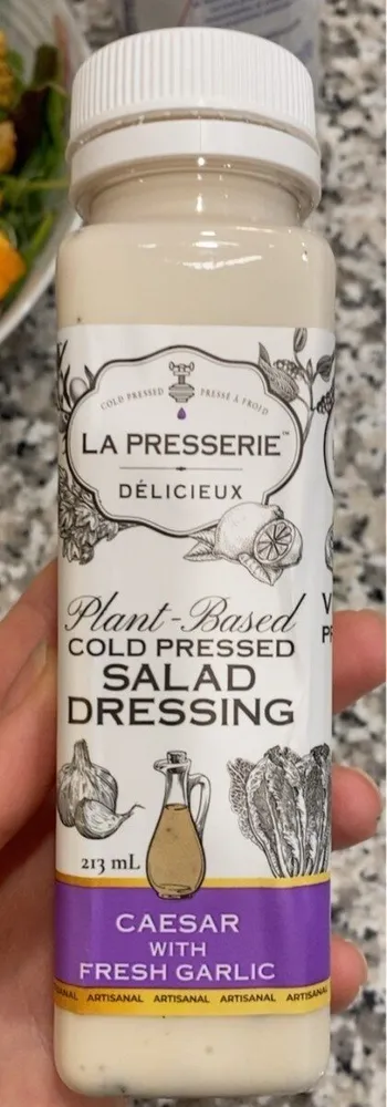 Plant based cold pressed salad dressinv ceasar with fresh garlic