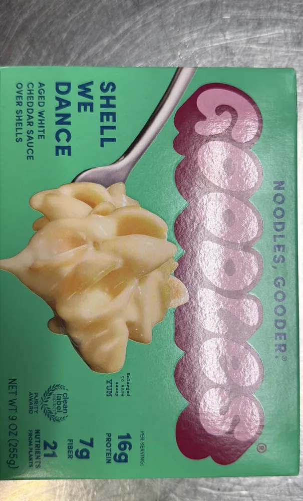 SHELL WE DANCE AGED WHITE CHEDDAR SAUCE OVER SHELLS