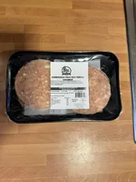 Hamburguesa de pollo rulo de cabra con cebolla caramelizada