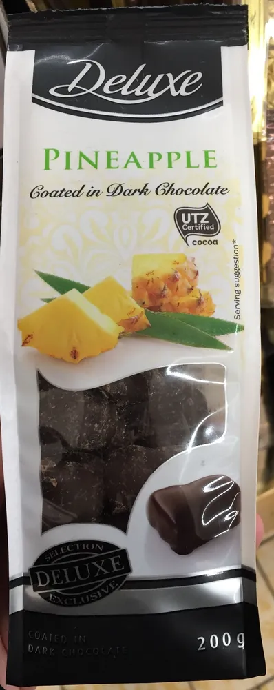 Pineapple coated in dark chocolate