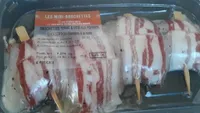 Brochettes de julienne entourées de lard séché