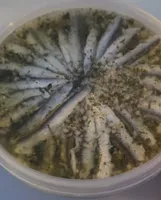 Filets d'anchois marinés à l'ail et persil