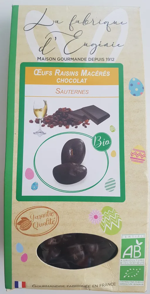 Raisin sec macéré au vin blanc doux Sauternes et enrobé de chocolat noir aromatisé pêche