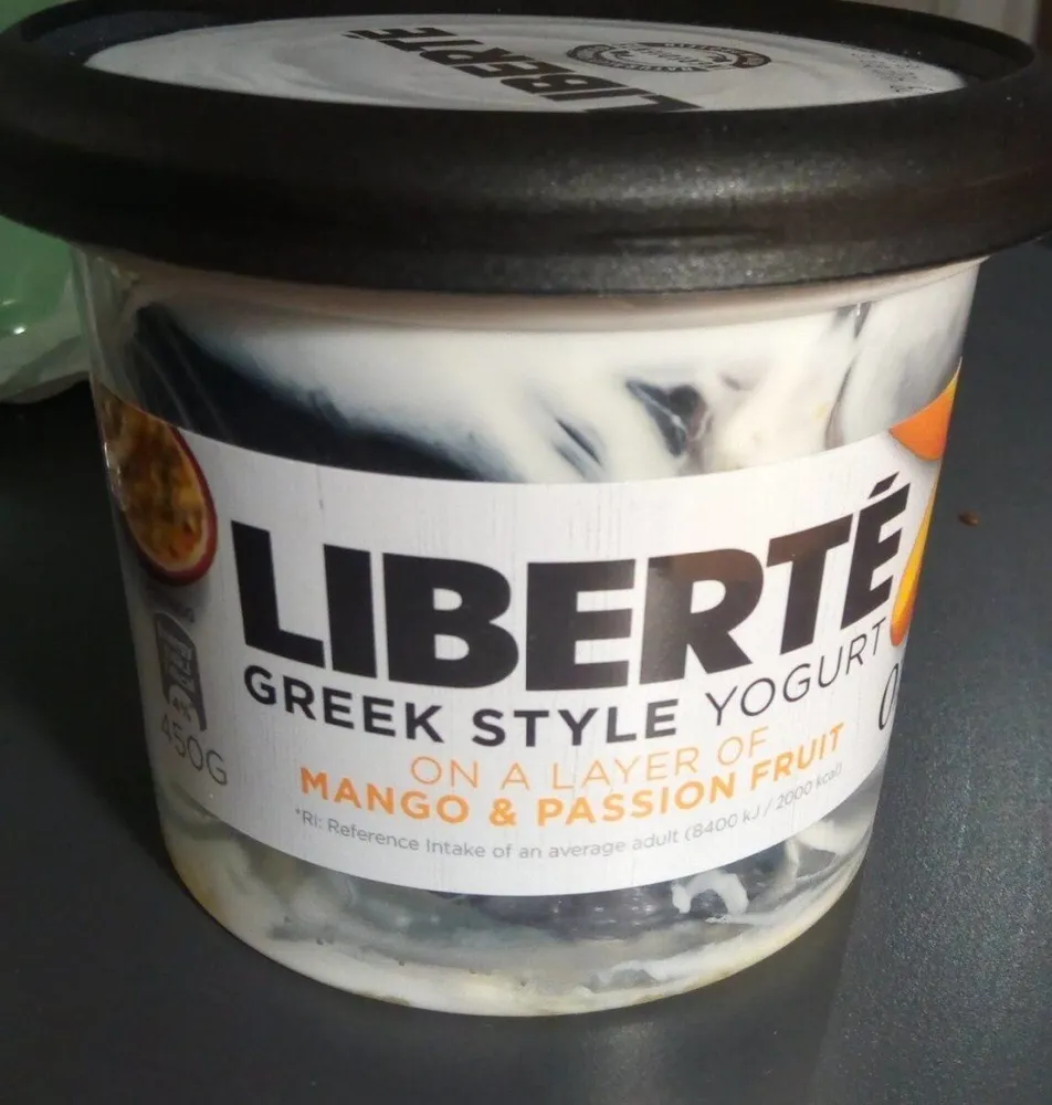 Greek style yogurt on a layer of mango and passion fruit