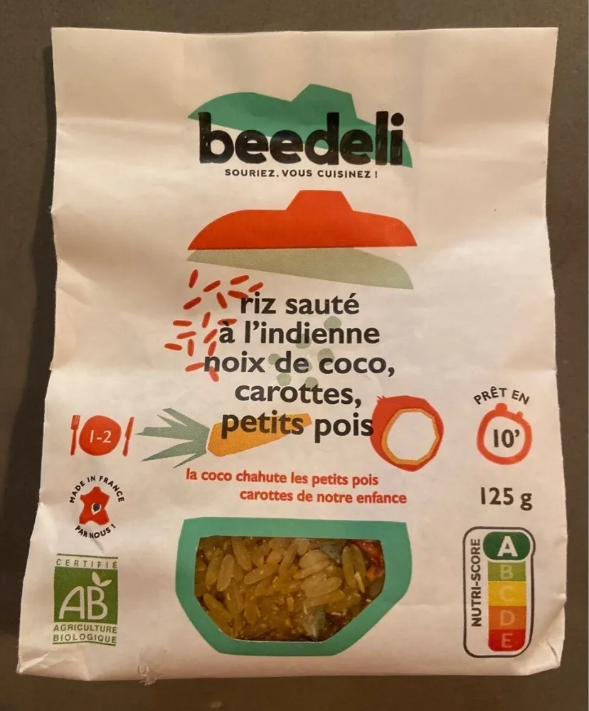 Riz sauté à l'indienne, noix de coco, carottes, petits pois