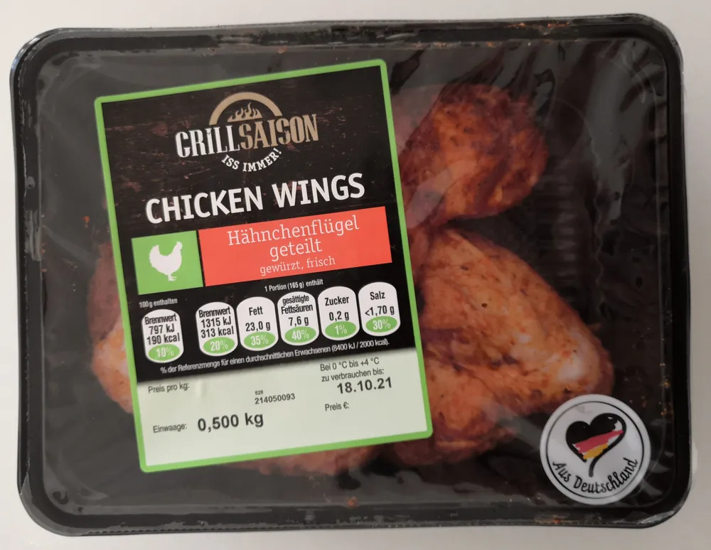 Chicken Wings. Hähnchenflügel, geteilt, gewürzt, frisch