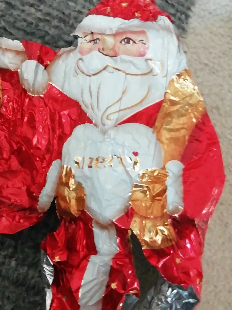Weihnachtsmann aus Edel-Vollmilchschokolade "merci"