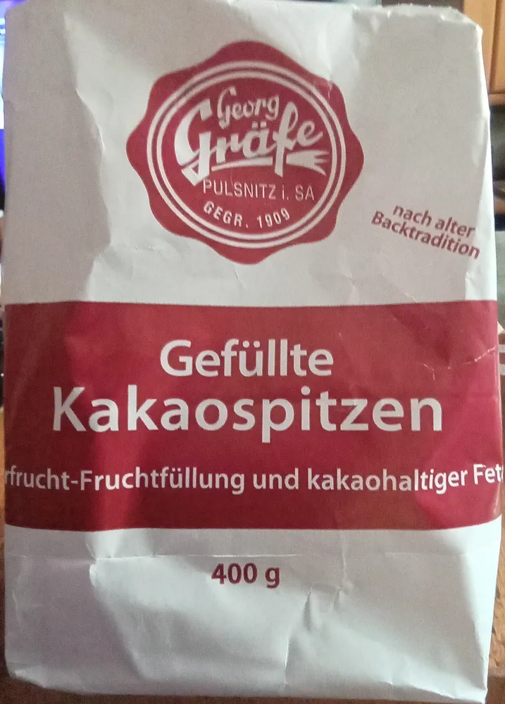 Gefüllte Kakaospitzen mit Mehrfrucht-Fruchtfüllung und kakaohaltiger Fettglasur