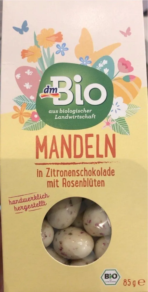 Mandeln in Zitronenschokolade mit Rosenblüten