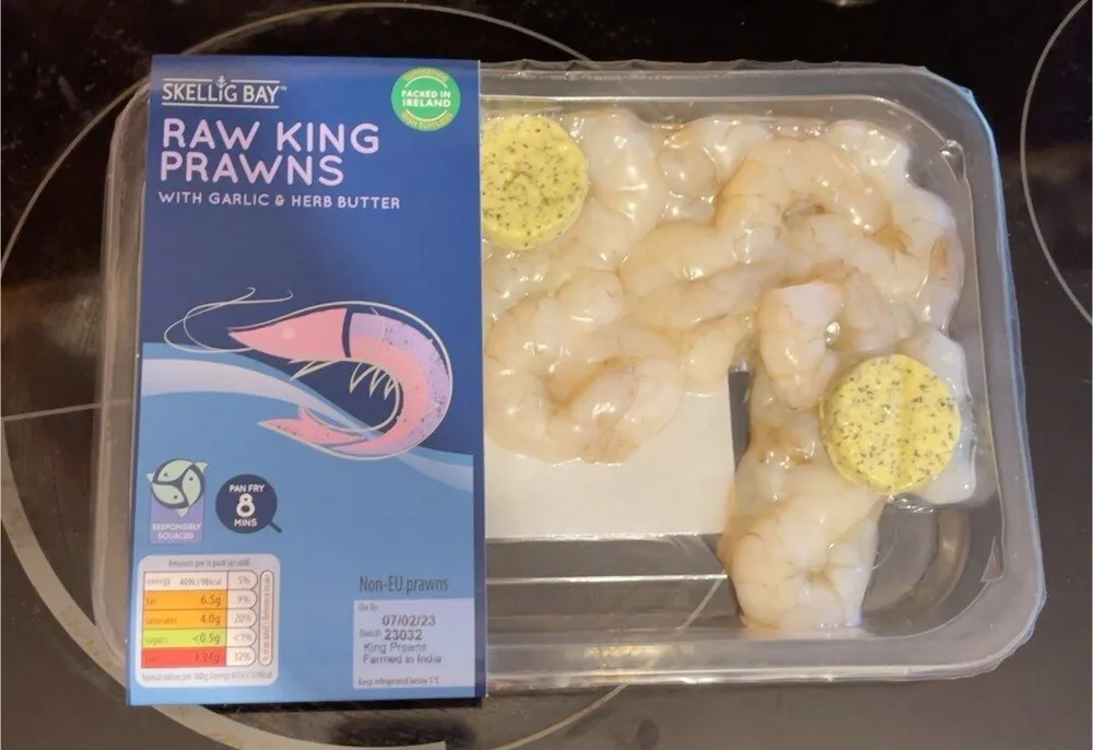 Raw king prawns with garlic herb butter