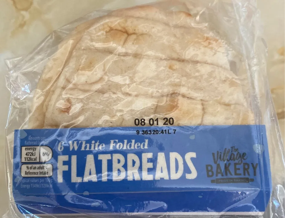 Six white folded flatbreads