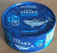 Drained tuna steaks in brine