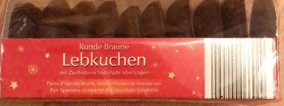 Pain d’épices bruns, ronds, enrobés de chocolat noir