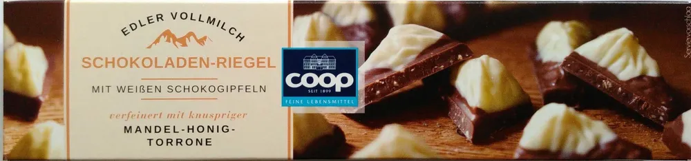 Schokoladen-Riegel mit weißen Schokogipfeln verfeinert mit knuspriger Mandel-Honig-Torrone