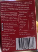 Hohlkörper aus Vollmilchschokolade 91,1% dekoriert mit weißer Schokolade 6,8%, Zartbitterschokolade 0,4% und Dekor auf Kakaobutter- und Milchpulverbasis 1,7%