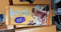 Шоколад молочний "Lacmi Crumble-Bumble", з молочною начинкою, кукурудзяними пластівцями та печивом