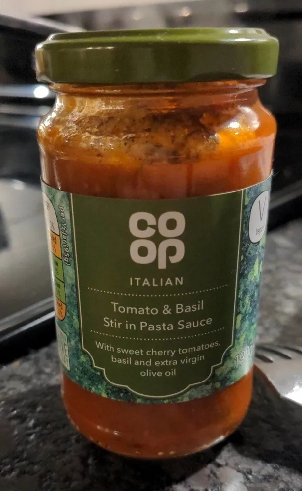 Tomato and basil stir in pasta sauce