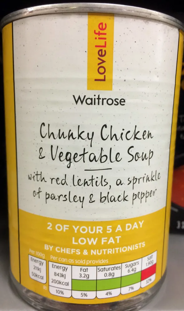 Chunky chicken and vegetable soup with red lentils, a sprinkle of parsley & black pepper