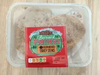 Golden breaded turkey steaks
