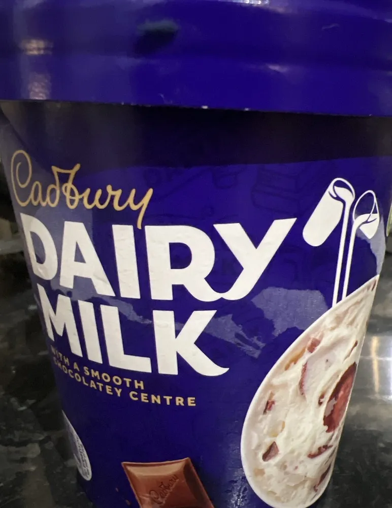 Vanilla Ice Cream With Milk Chocolate Pieces And A Chocolate Sauce Core