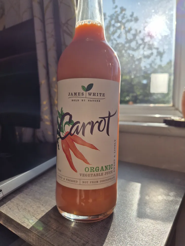 James White Drinks Organic Carrot Juice