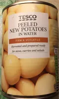Peeled potatoes in water