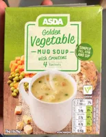 Golden vegetable mug soup with croutons