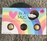 In a mug milk chocolate melts with marshmallows