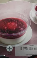 Panna cota cream and raspberry coulis