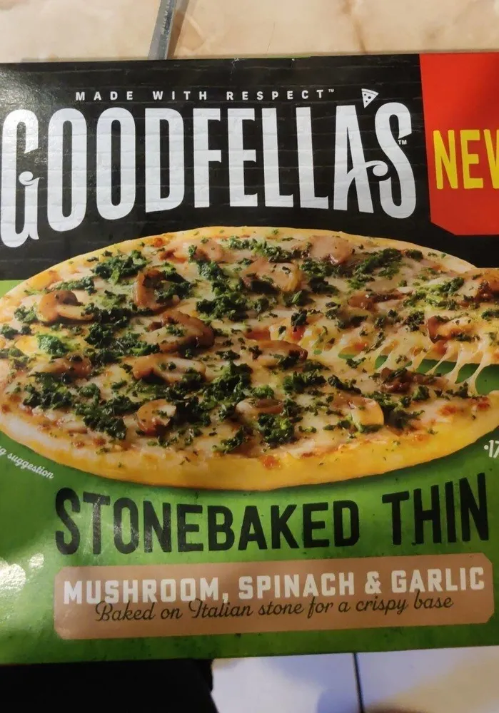 Stonebaked thin mushroom spinach and garlic pizza