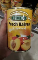 Freshly peach halves in light syrup