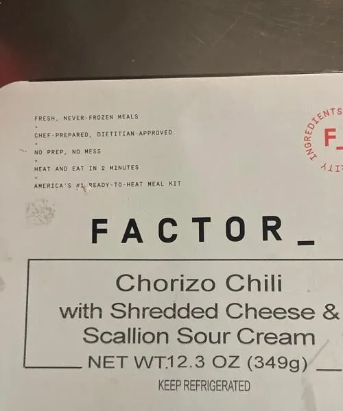 Chorizo Chili with Shredded Cheese and Scallion Sour Cream