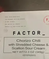 Chorizo Chili with Shredded Cheese and Scallion Sour Cream