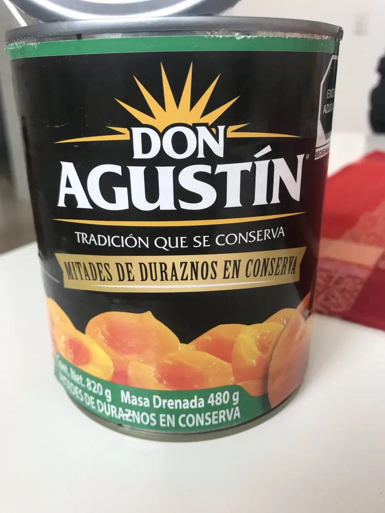 Mitades de durazno en conserva