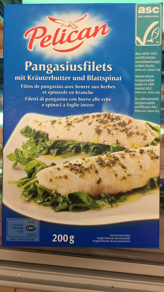 Filets de pangasius avec beurre aux herbes et épinards en branche