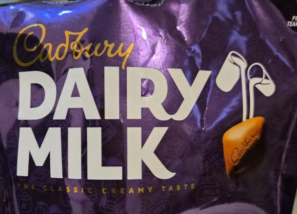 MIL MIL DAIRY Cadbury DAIRY MILK THE CLASSIC CREAM