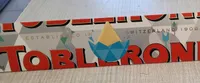 Toblerone chocolat blanc miel amande nougat